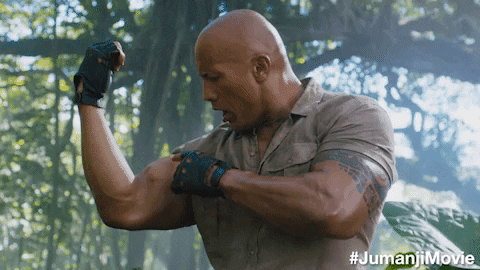 Dwayne Johnson in Jumanji exploring his new muscles